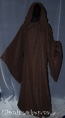 Robe:R315, Robe Style:Qui Gon Jin or Mace Windu, Robe Color:Brown, Fiber:light weight double sided<br>synthetic woven moleskin<br>outside and satin inside., Neck:28", Sleeve:36", Chest:Up to 74", Length:66", Height:Up to 6' 6". Can be shortened, Note:Comfortable to wear<br>around the house<br>nd around town.<br>This hooded robe is<br>made of a light weight<br>double sided synthetic<br>woven moleskin outside<br>and satin inside.<br>Accented with a hidden<br>hook and eye clasp<br>and pointed sleeves<br>this robe is modeled<br>after Mace Windu .<br>Can be used for <br>Quigon Jin as well.<br>Machine washable..